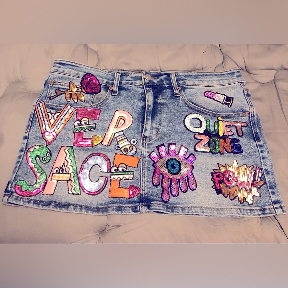 Mini denim designer patch skirt